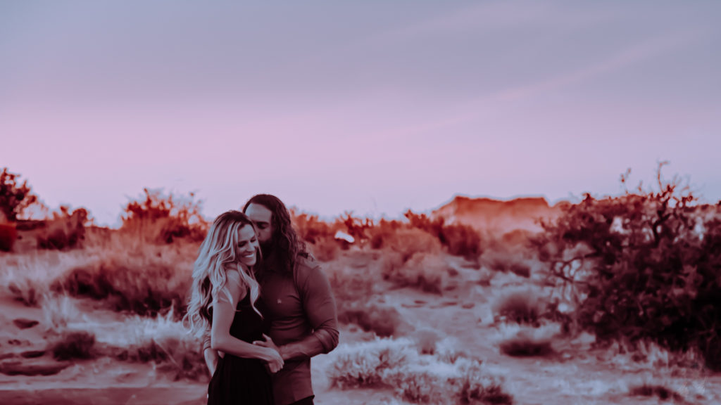 St George UT couple photos done by worldwide elopement visuals, happy lovers kissing in the Snow Canyon Dunes.